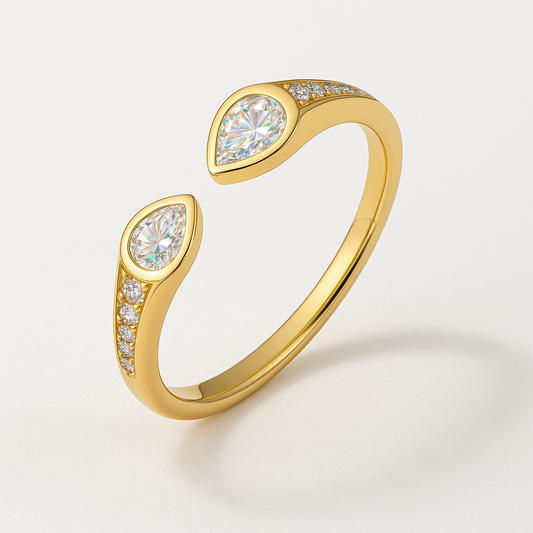 Gold ring with moissanite accents on a light gray background